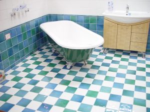 bathtub-on-green-blue-and-white-tiles-300x225.jpg