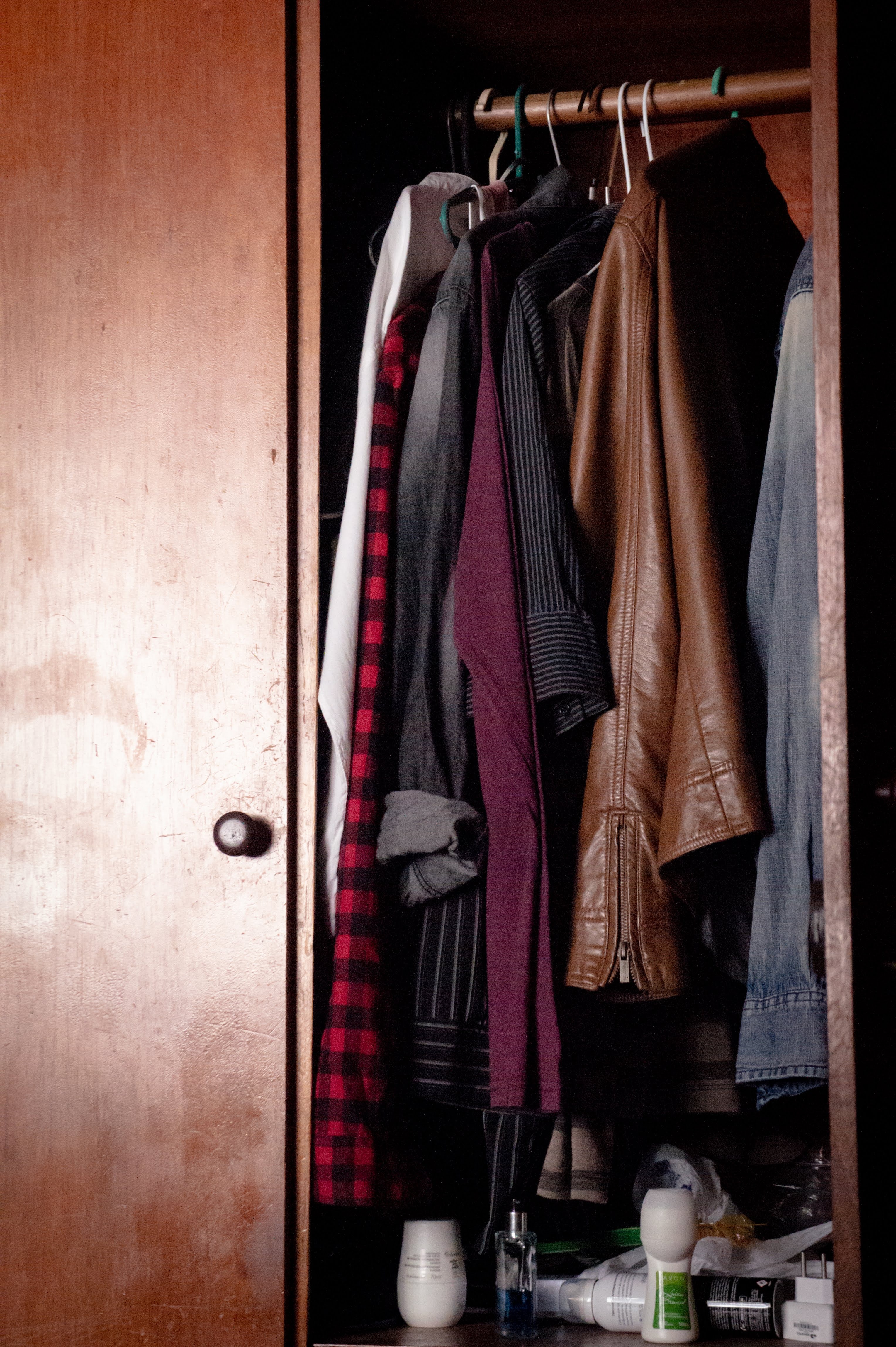 Wardrobe with casual clothes on hangers