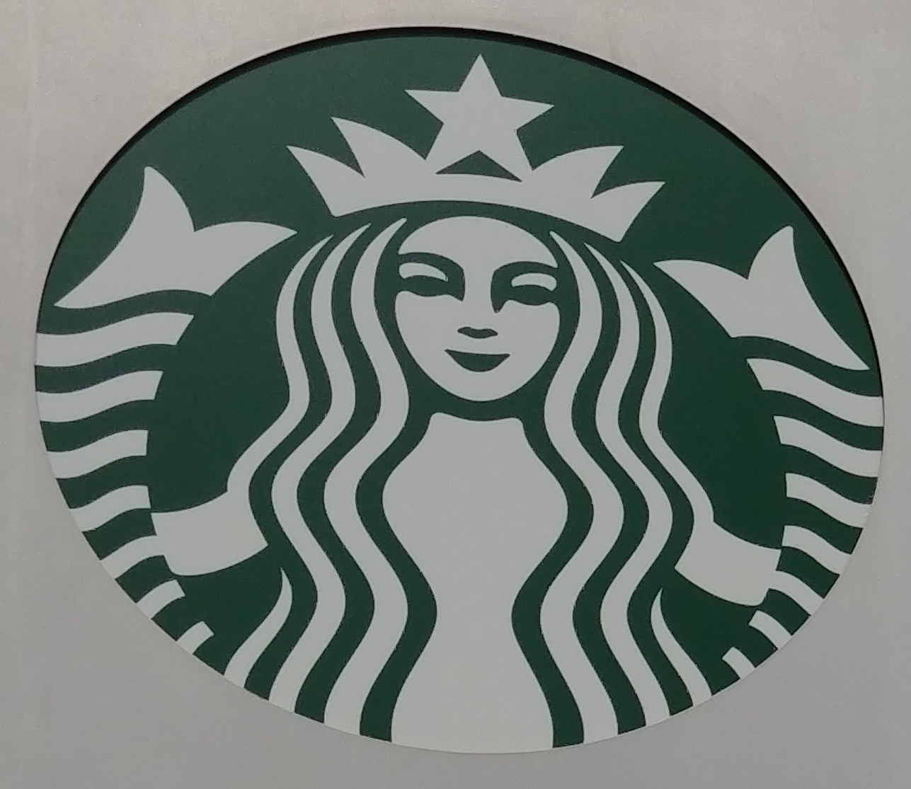 Photo of the siren in the Starbucks logo.