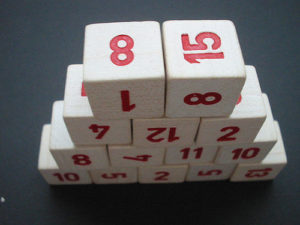 Stack of dice with numbers rather than dots on each side