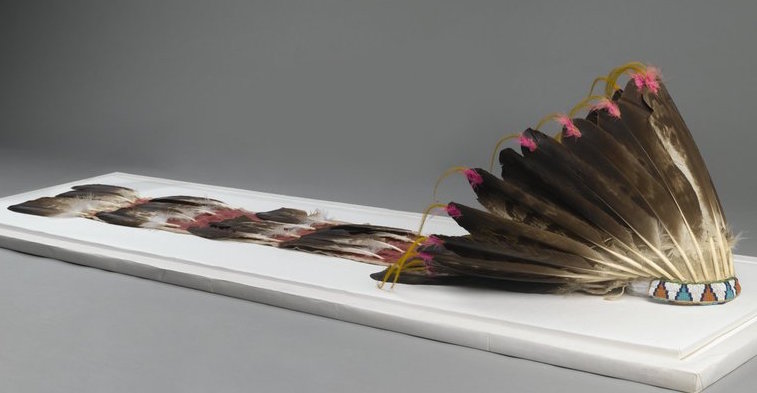 Sioux or Cheyenne Artist, Feathered War Bonnet (Pawhuska, Oklahoma), late 19th-early 20th c., feathers, beads, pigment, hide, dyed horsehair, 174 x 21.5cm (The Brooklyn Museum)