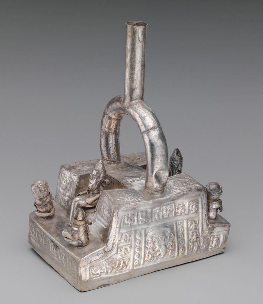 Chimú bottle depicting a throne with figures, 1300–1500, Peru, silver, 23.5 x 11.1 x 16.5 cm (The Metropolitan Museum of Art)