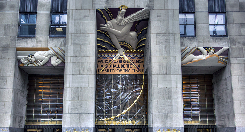 Lee Lawrie, Wisdom (center), with Light (right) and Sound (left), 1933, painted and gilded limestone, glass (photo: Terry Robinson, CC BY-SA 2.0)
