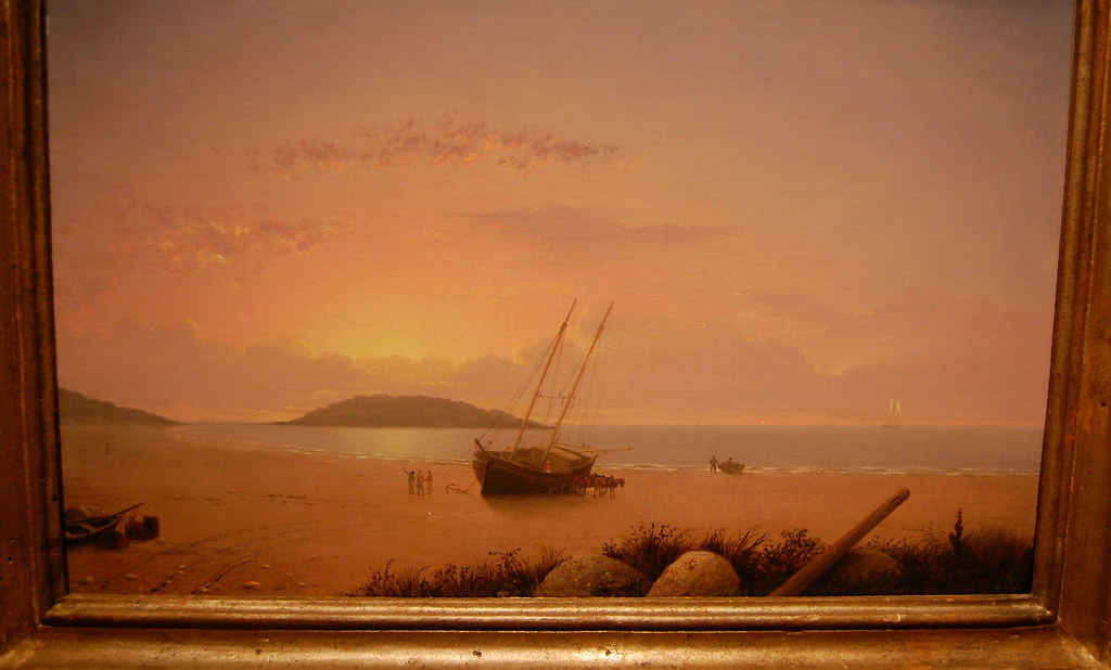 A painting of a grounded boat on the seashore at sunset