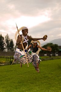 A photo of Rwandan dance troupe performing traditional dance.