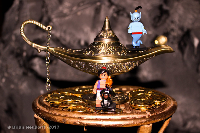 Image of Lego characters from Aladdin in front of a gold lamp
