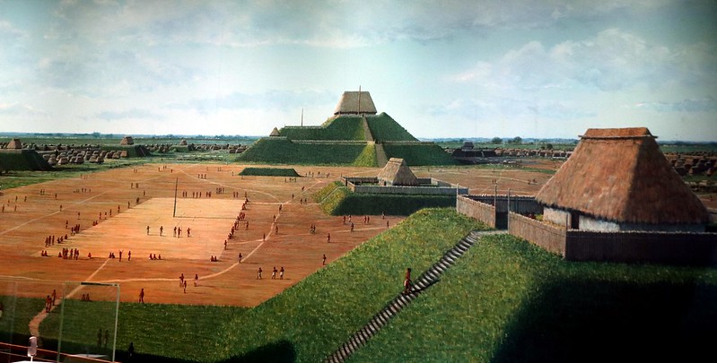 A building on top of a large flat-topped pyramid overlooking a courtyard. Details in text.