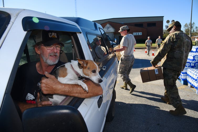 National Guard members distribute food and water in Miller County, Georgia, Oct. 12, 2018, during Hurricane Michael relief efforts. "Photo" by Sgt. Amber Williams, Georgia National Guard is licensed under CC BY 2.0