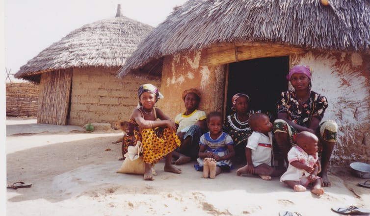 A mother and her children outside their home in rural Nigeria. Shobana Shankar, CC BY-SA