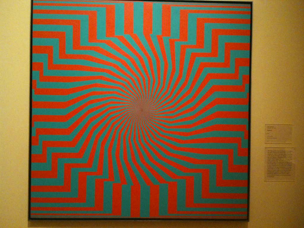 Red and green painting with lines that converge in the middle