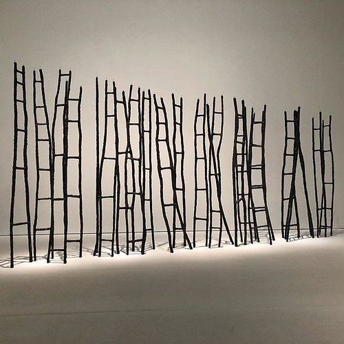 a metal sculpture of ladders