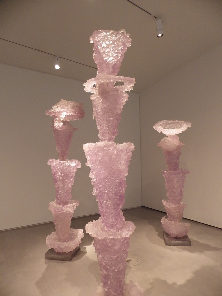 pink casted items in tall cylinders