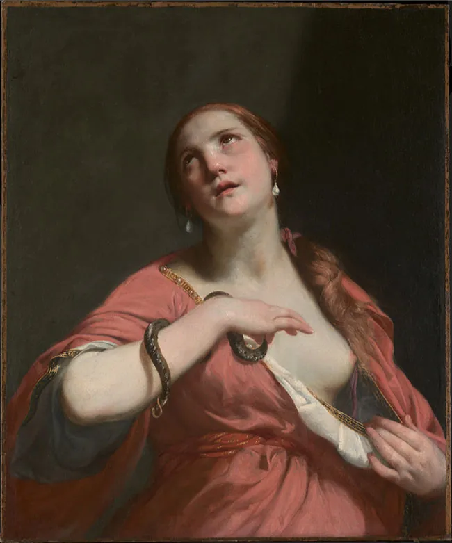An image of a painting is shown on a dark black background. A very pale woman is seen looking up to the top left of the image with glassy eyes. She has reddish hair tied at the base of her neck and hanging over her left shoulder. She wears white drop earrings and a pale red dress with gold trim, opened at the left to reveal her breast. A small black snake weaves around her right arm which is bent at the elbow and held above her chest.