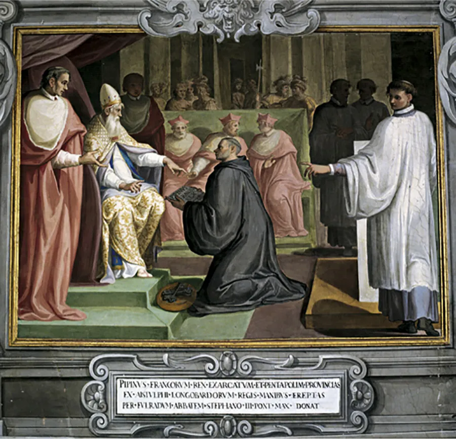 An image of a painting is shown. The frame surrounding the image is gray with gold trim on the inside. A lion's head is carved at the top with décor surrounding it and a white plaque with décor around it along the bottom. Words are written in black inside the plaque. In the image at the left, a white bearded man sits on a large brown chair atop a two tiered green platform. He wears a tall conical white hat with gold trim, a long white shirtdress with gold décor and a similar robe over his shoulders held together with a red pin. His left arm extends out to a man kneeling in front of him in a black robe and shaved head with one small ring of hair around his head. He holds a white object with black lettering on it and at his knees is a round brown plate holding black skeleton keys. To the left of the sitting man in the forefront stands a tall man in red and white long robes, brown hair and a pale face. He holds his right hand out of his robes. At the right forefront of the image, a man in a long white robe over a long blue robe stands with his left arm extended to the man kneeling. His body is facing the back but his head is turned toward the kneeling man as well . He has short brown hair and a white and black collar on his robes. In the middle background of the image three men sit on a large green bench with a tall back. They wear long pink and white robes and a four pointed pink hat. The two men on the right are facing each other. Behind the bench, eight figures painted brown can be seen standing, wearing large hats and one holding a tall, thin axe. The wall behind them is stone colored in vertical panels. Two dark shadowy figures are seen to the right of the green bench and a figure in red and gray robes stands to the left of the bench with his face obscured.
