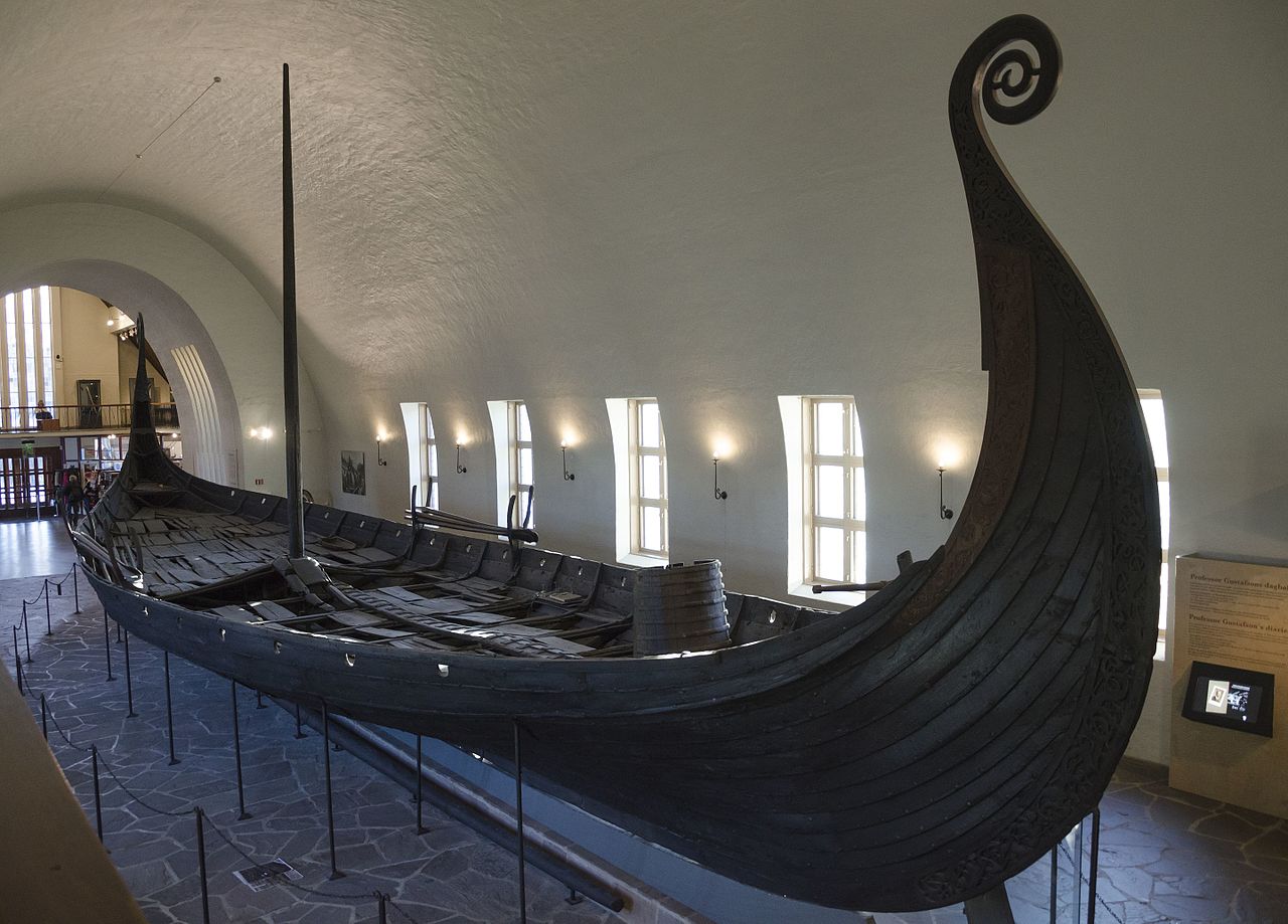Recovered Viking longship in Norway, featuring a shallow draft, benches on which the Vikings would sit and row, and a high prow.