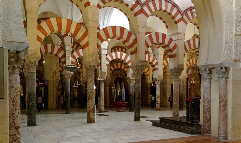 Arches on the interior of the former Mosque (now cathedral) of Cordoba, with red and white banded stone.