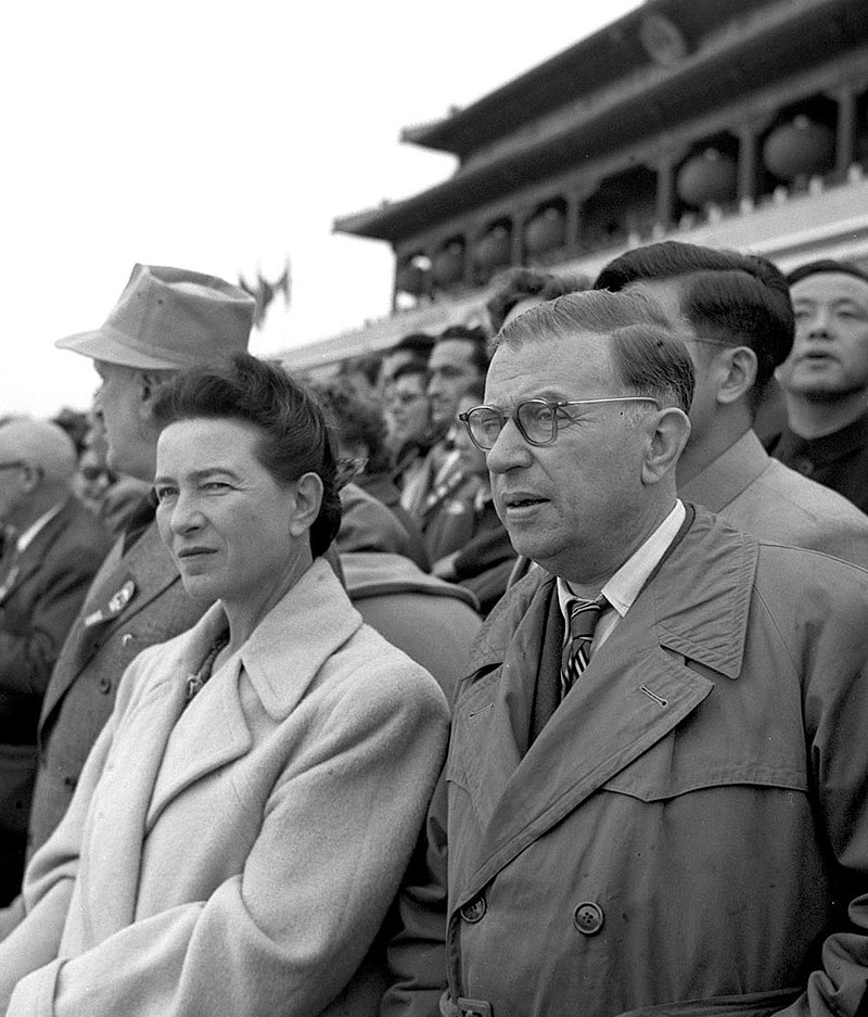 Simone de Beauvoir and Jean-Paul Sartre in a crowd during a visit to communist China.