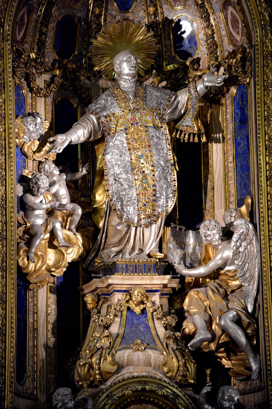 Statue of Ignatius of Loyola covered in gilding and decorations.
