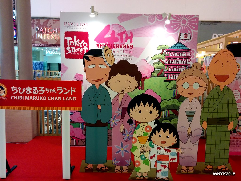 a cartoon family made from cutouts displayed in a store