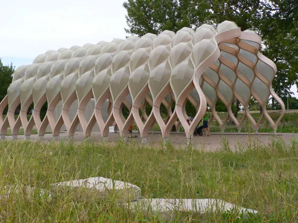 a wooden shaped building like a bee hive
