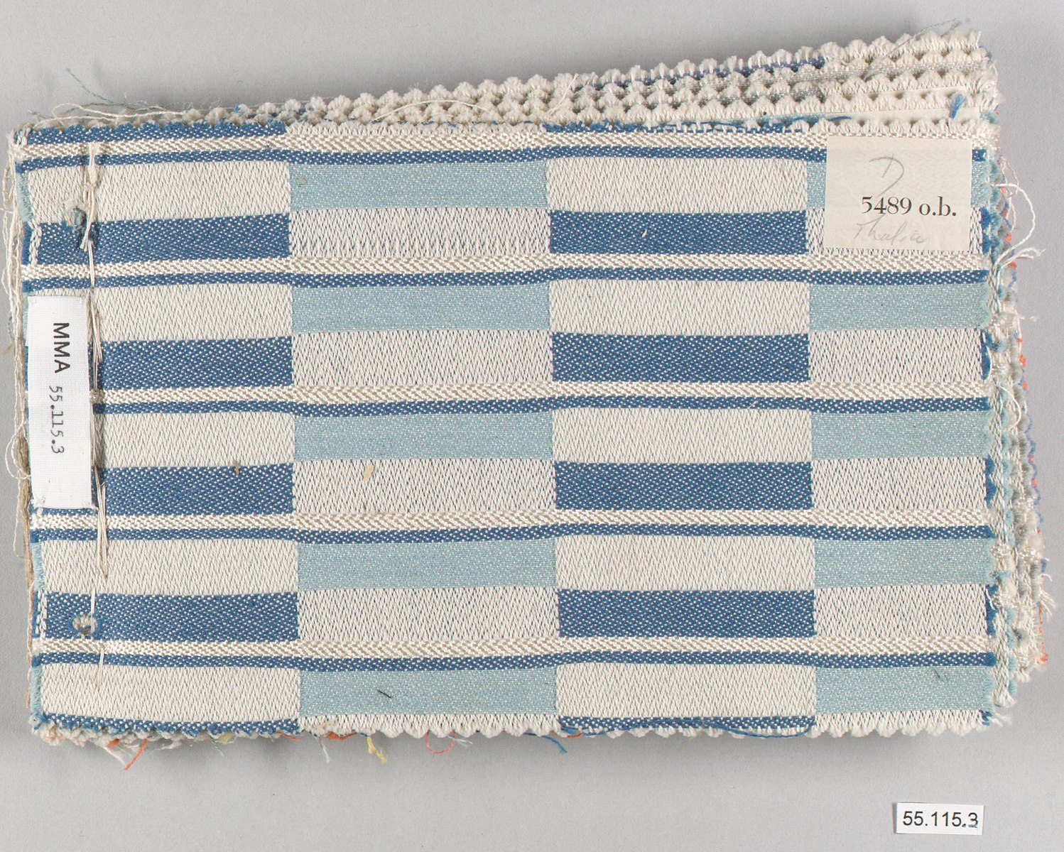 a book of textile weaving in blues and whites
