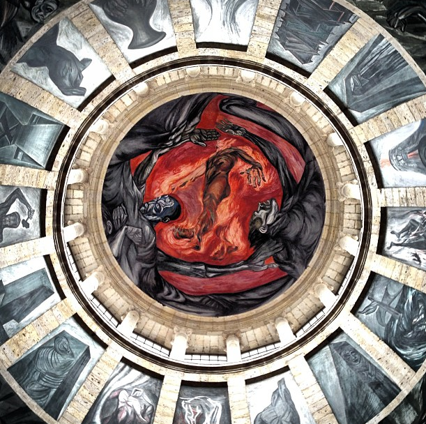 Depicted above is the fresco also known as “The Man of Fire”, in this surrounded by a series of arched panels, a self-sacrificing man is in the center of it all