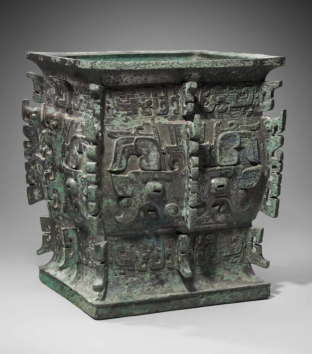 a square bronze vessel with intricate carvings