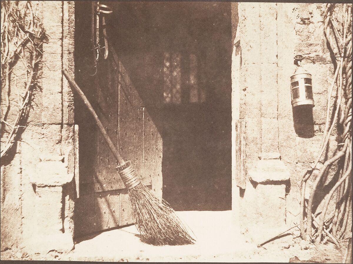 Salted print photograph of an open barn door.