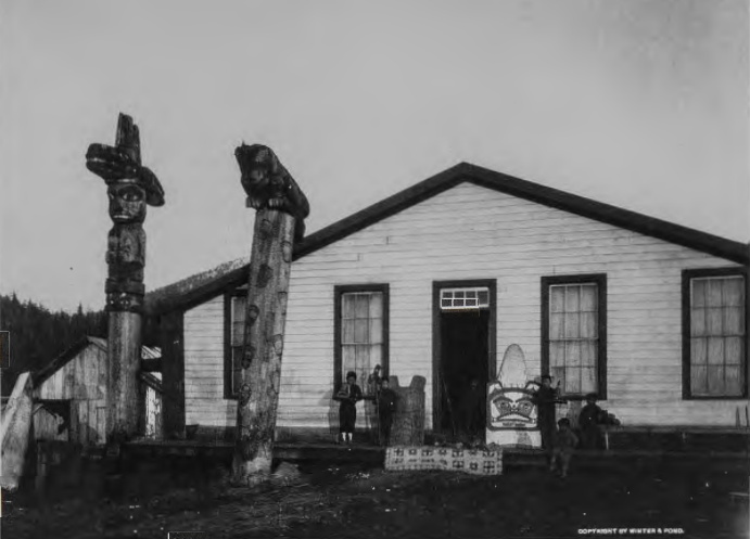 Figure 9.44: LLOYD WINTER & E. PERCY POND, Totem poles, Chief Shake's House, Fort Wrangell, Alaska, c. 1900. Photograph. Alaska Historical Society, Juneau.