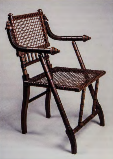 Figure 10.27: GEORGE HUNZINGER, Armchair, patented in 1869, 1876. Walnut, steel mesh. Brooklyn Museum of Art, New York.