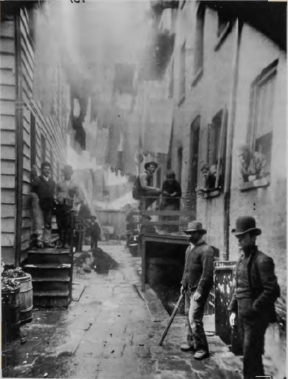 Figure 11.27: JACOB RIIS, Bandit's Roost, 59½ Mulberry Street, c. 1888. Gelatin silver print, 19 3/16, x 15½ in (48.6 X 39.4 cm). Museum of the City of New York.