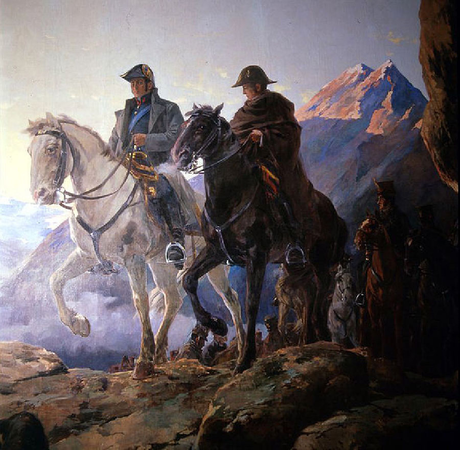 Two men wearing military uniforms are on horseback. Mountains are visible in the background.