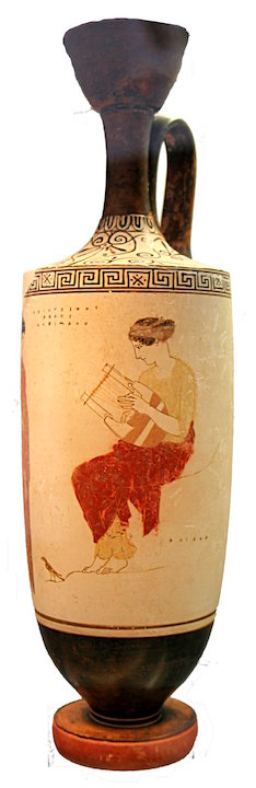 This is a photo of pottery painted with a scene of the muse seated wearing draped garments and playing a lyre.