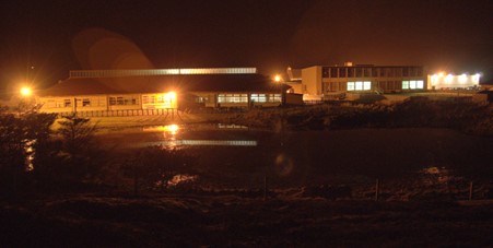 A school parking lot at night