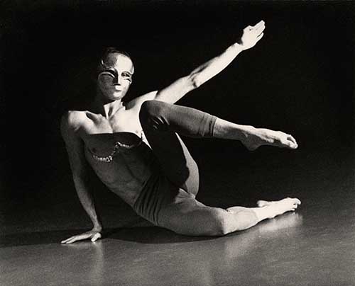 A person in a mask on the floorDescription automatically generated