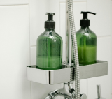 two shampoo bottles in the shower rack