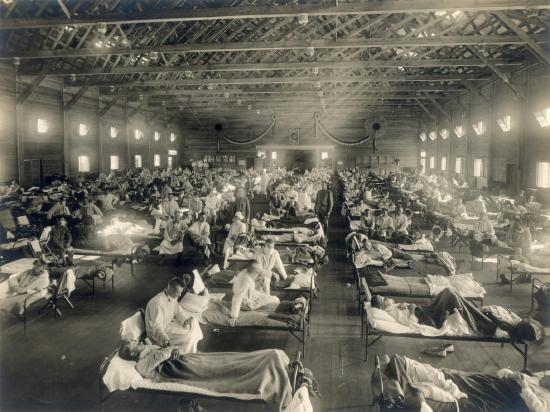 Rows of beds with patients during a flu epidemic in Kansas. Details in text.