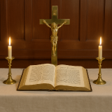 Picture of an open Bible and candles on either side