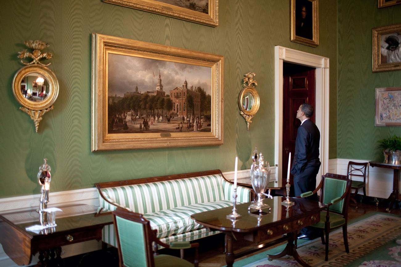 Barack Obama in the Green Room next to a striped D. Phyfe sofa, ca 1810-15, Mahogany, cherry, pine, gilt brass, and modern upholstery 