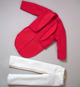 Photo of hand-made Ken doll clothes, a red tuxedo jacket and white pants.