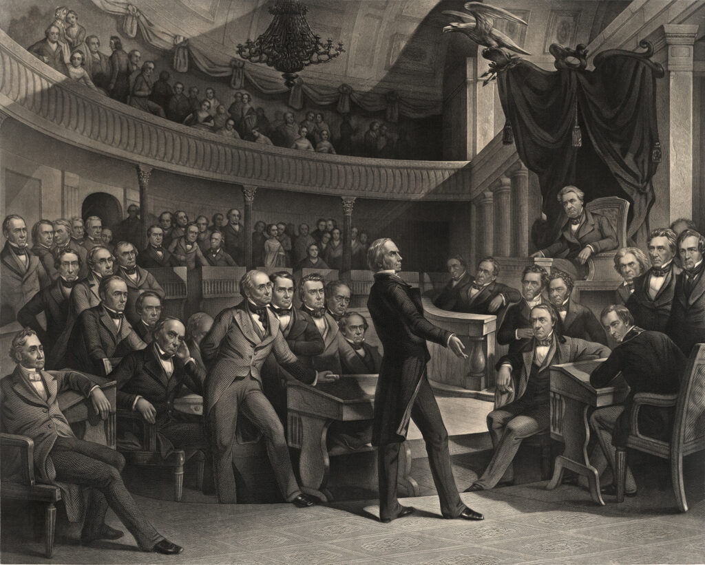 Henry Clay (&ldquo;The Great Compromiser&rdquo;) addresses the U.S. Senate during the debates over the Compromise of 1850. The print shows a number of incendiary personalities, like John C. Calhoun, whose increasingly sectional beliefs were pacified for a time by the Compromise. P. F. Rothermel (artist), c. 1855. Wikimedia. The scene shows a crowded legislative hall with ornate neoclassical architecture, including columns, draped decorations, and a curved gallery filled with spectators. Clay stands at a podium addressing the assembled senators, who are seated at their desks wearing frock coats and formal attire. 