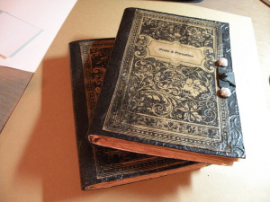 Photo of two stacked handmade books, the top one with the title "Pride and Prejudice"