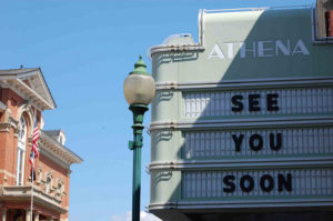 Movie marquee for the Athena theater. Message reads "see you soon."