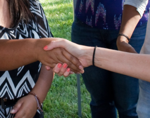 women shaking hands