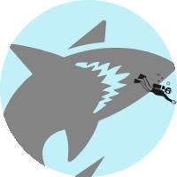 round image of a large shark chasing after a tiny diver