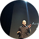 Image of a man onstage talking