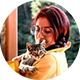 Round photo (like an email avatar) of a woman with a cat.
