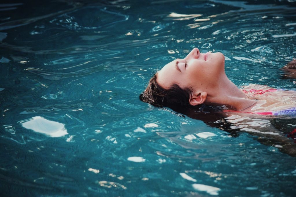 Woman, mostly head, floating in water