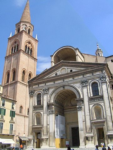 The facade of Sant Andrea. The Basilica has a classical front with a large barrel arch over the doors.