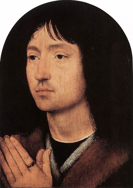 A more realistic portrait, the face is seen from an angle. The young man's black hair is nearly indistinguishable from the black background of the painting.
